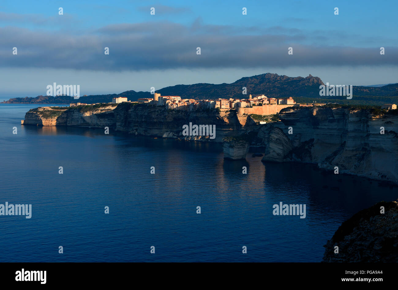 Rocky coast and old town of Bonifacio in the morning sun, Bonifacio, Corsica, France Stock Photo