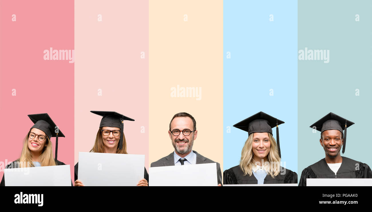 Senior teacher with his graduate students holding blank advertising ...