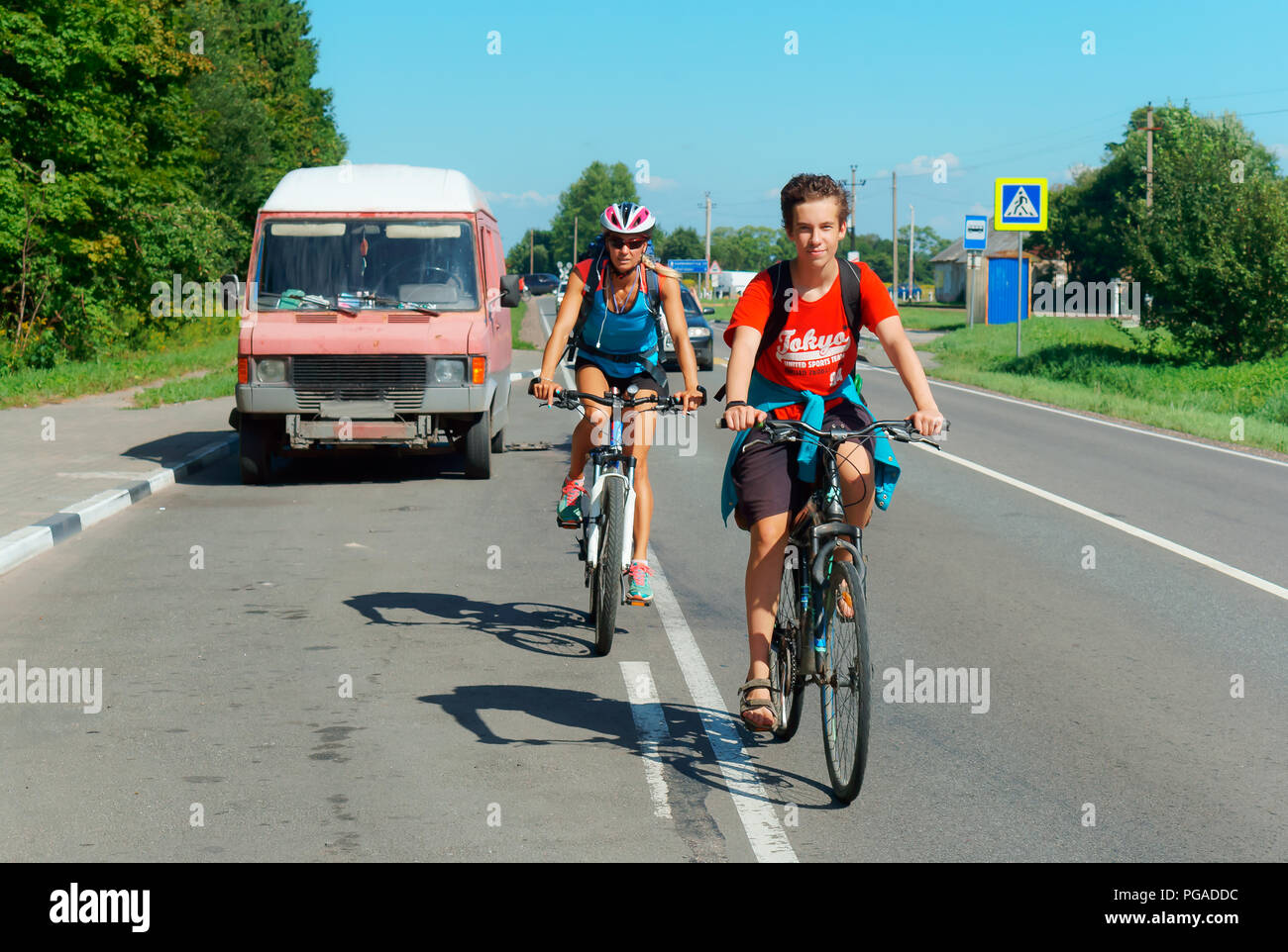 Kaliningrad, Russia, August 4, 2018, man and woman riding bicycles on the roadway, cyclists on the road Stock Photo