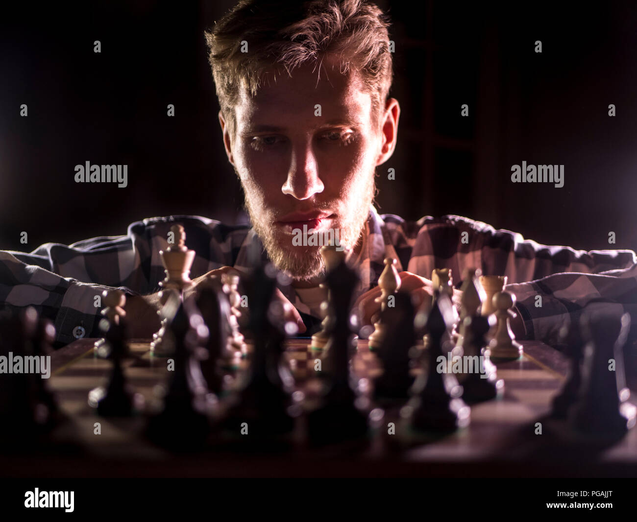 Senior man thinking about his next move in a game of chess Stock Photo by  dmytros9