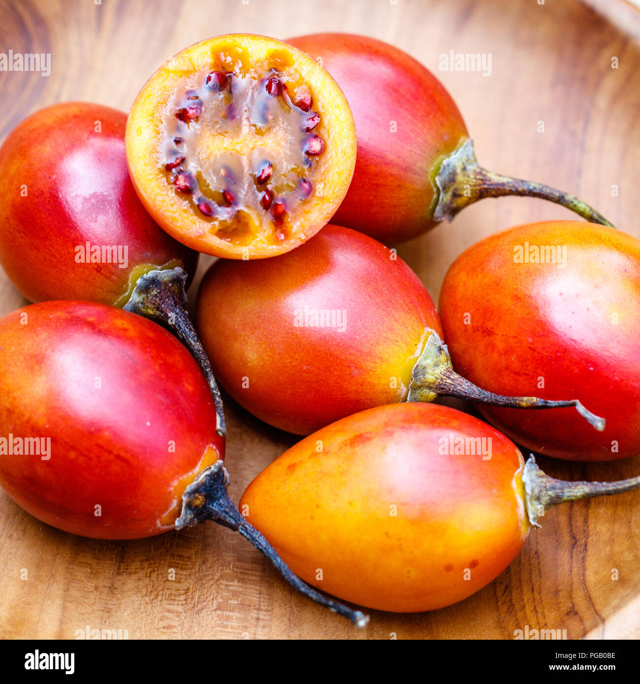 Fresh tamarillo fruit on a wooden tray. Bali, Indonesia. Stock Photo