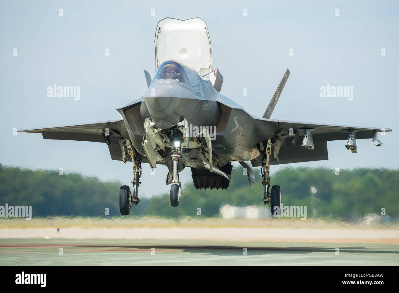 U.S. Marine Corps Maj. Michael Lippert, F-35 Pax River ITF test pilot, completes an vertical landing at Naval Air Station Patuxent River, Maryland, Aug. 16, 2018, as part of the Queen Elizabeth workups in preparation for the First of Class Flight Trials (Fixed Wing) aboard Britain’s newest aircraft carrier, HMS Queen Elizabeth.   Lippert, along with ITF pilots Royal Navy Cdr. Nathan Gray, Royal Air Force Sqn. Ldr. Andy Edgell and BAE Systems Peter Wilson, and nearly 200 ITF experts will embark with two F-35B test jets and several test equipment to evaluate the fifth-generation aircraft perform Stock Photo