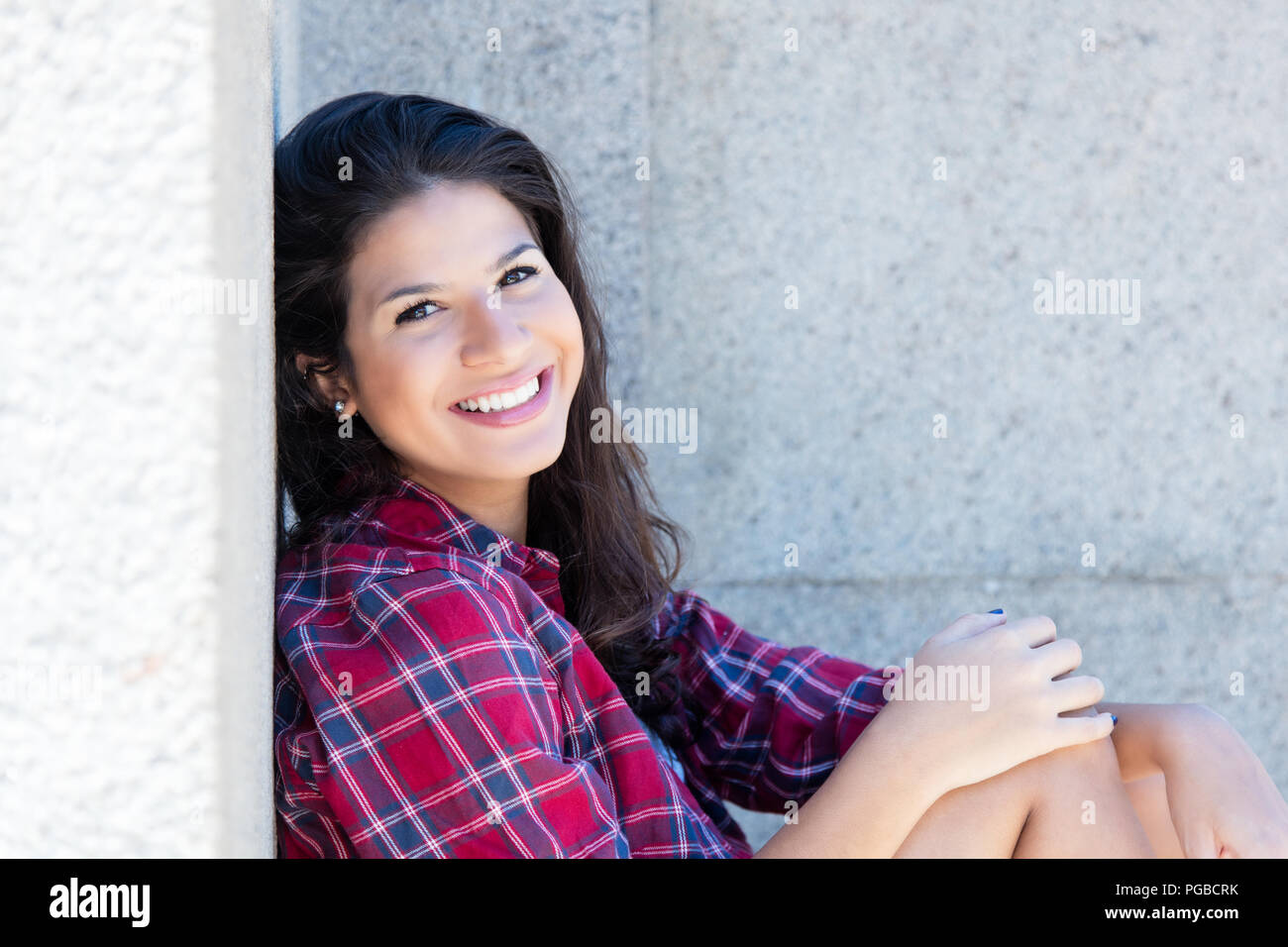 Laughing caucasian woman in casual clothes outdoors in the summer Stock Photo