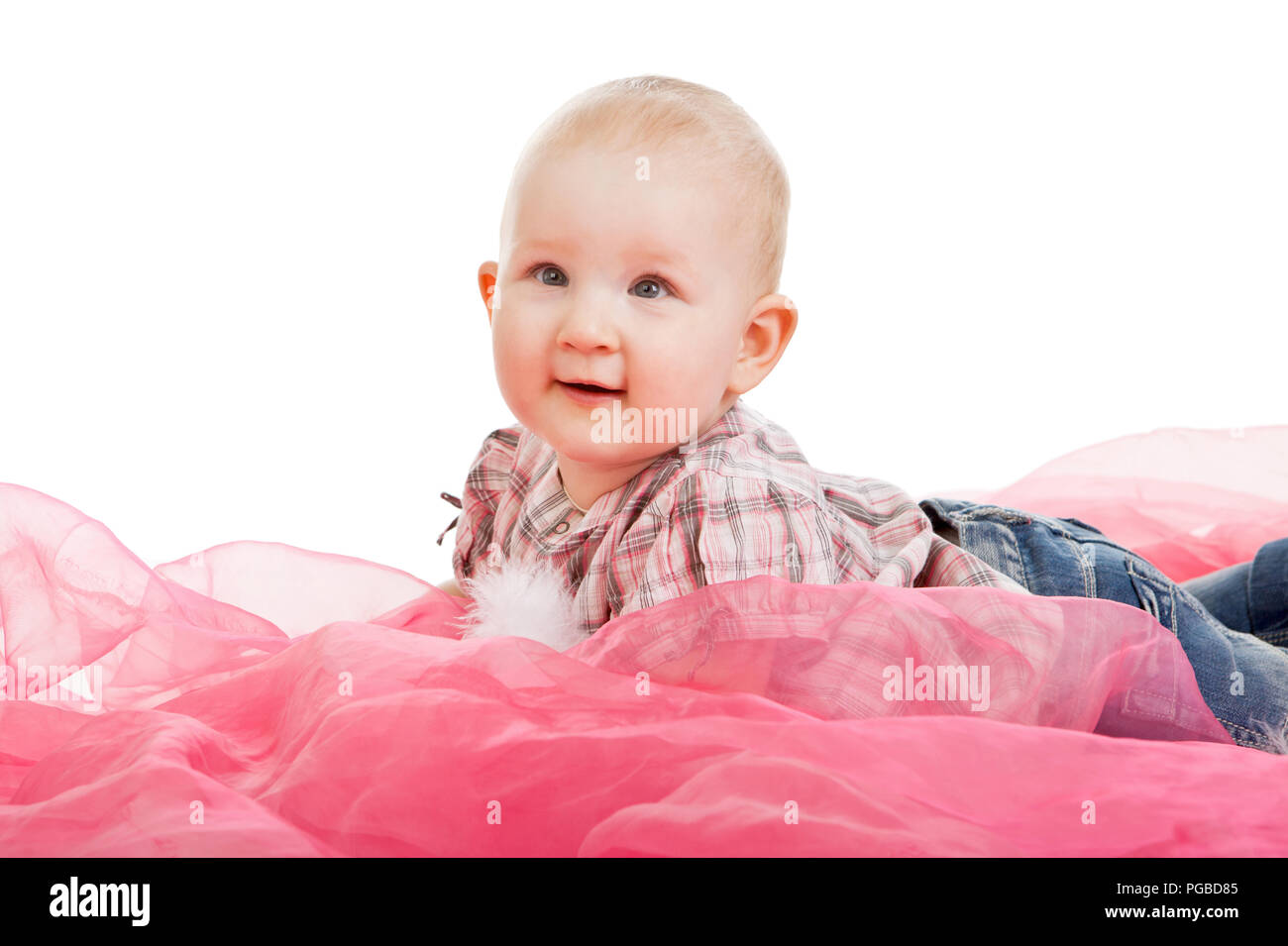 cute baby girl is lying on her tummy isolated on the white background Stock Photo