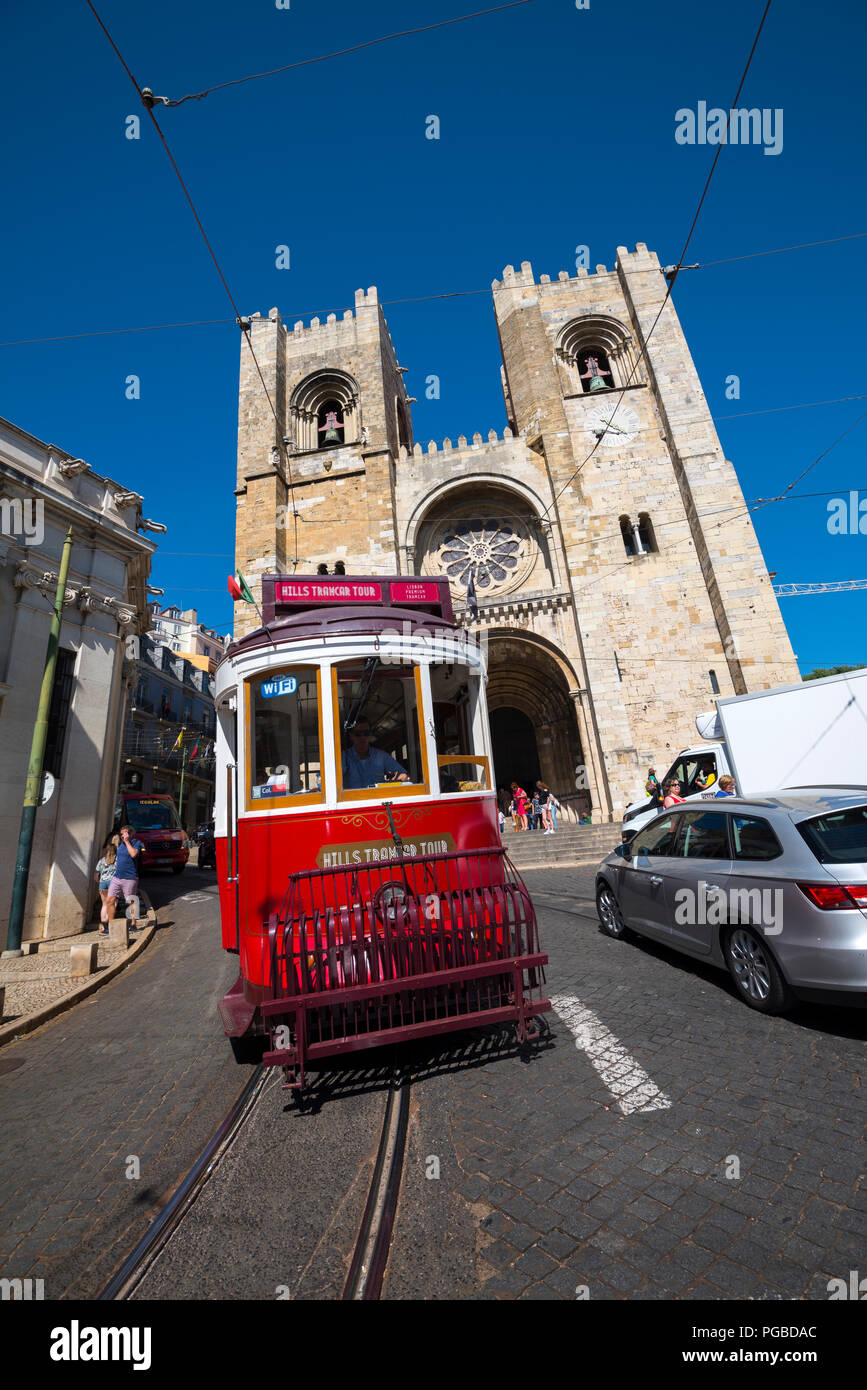 The famous trams in front of Cathedral of St. Mary, Lisbon, Portugal. Stock Photo