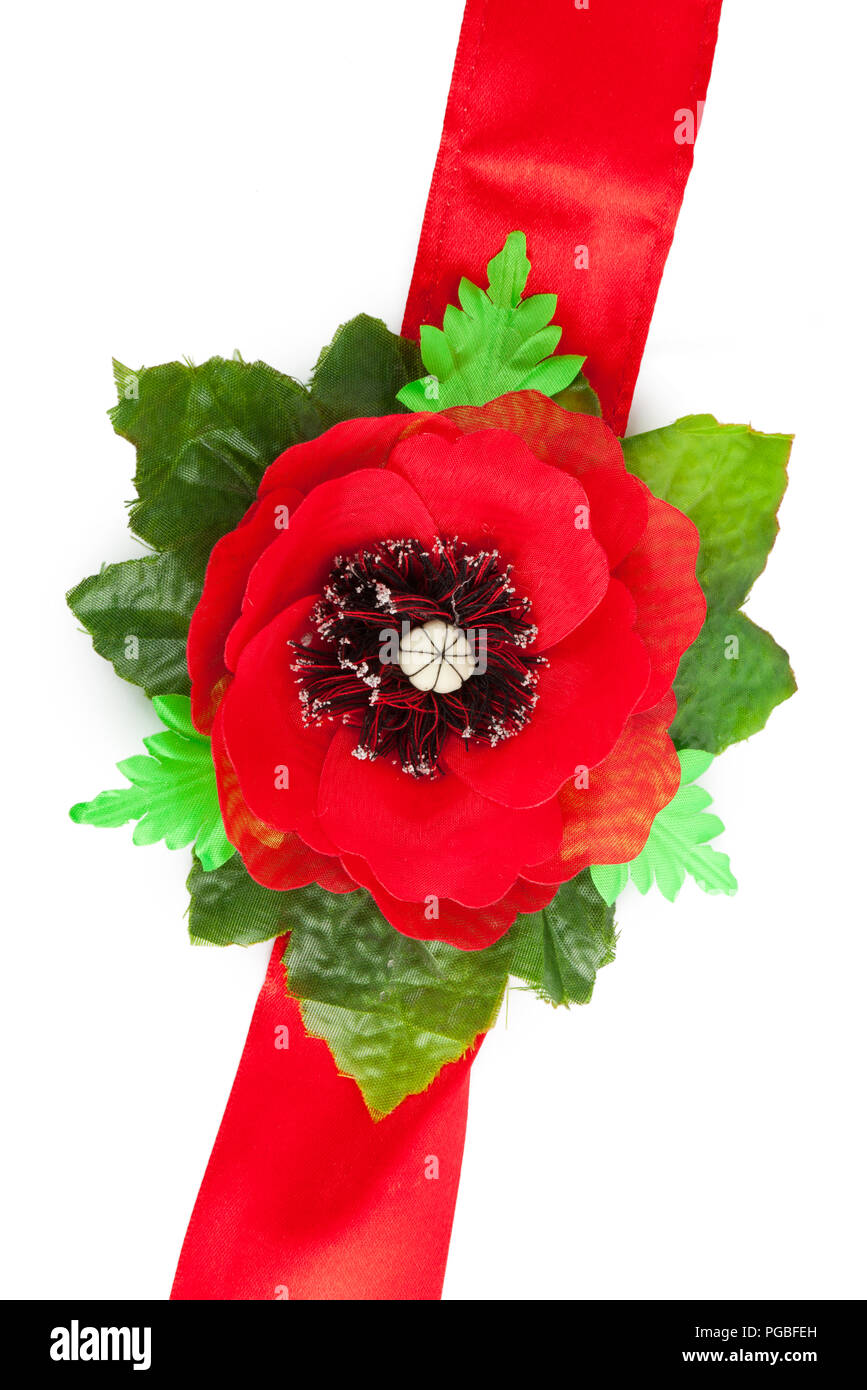 Red tape with a poppy from a fabric Stock Photo