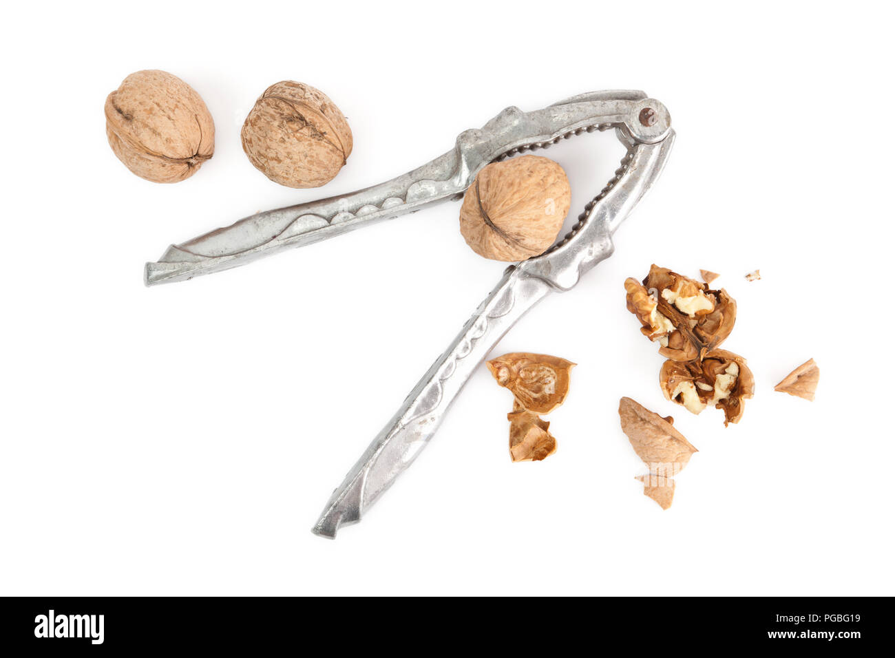 Nutcracker and walnuts isolated on a white background Stock Photo