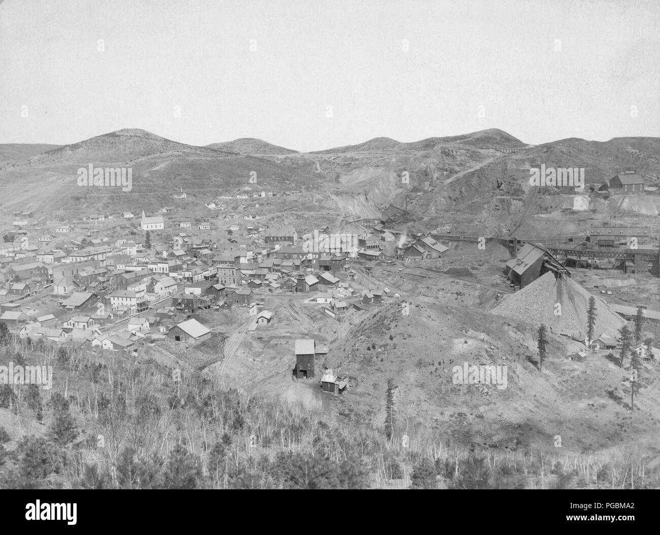 Distant view of mining town; hills in background. Stock Photo