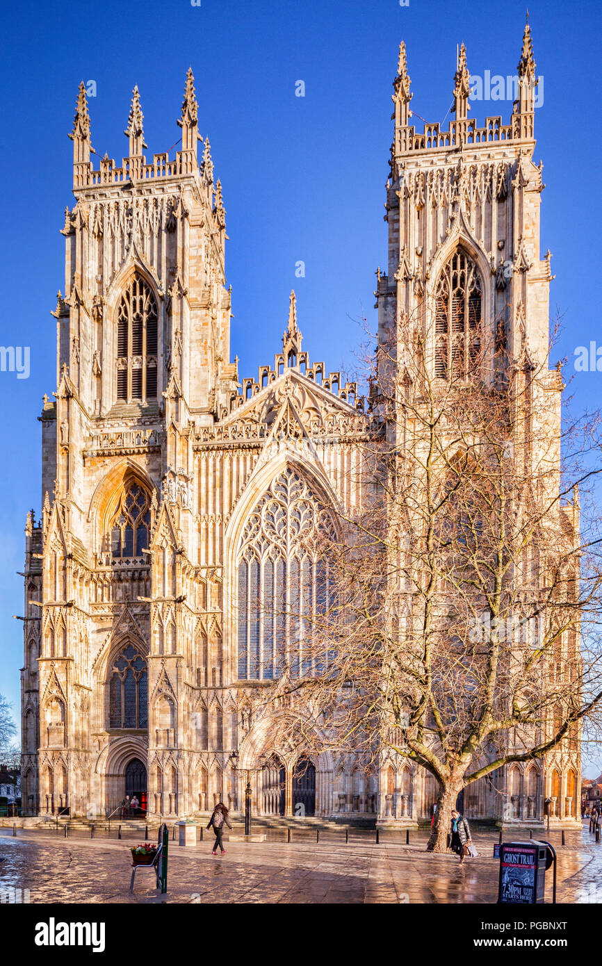 The West facade of York Minster, seen in winter after a shower, with beautiful clear blue sky. Stock Photo