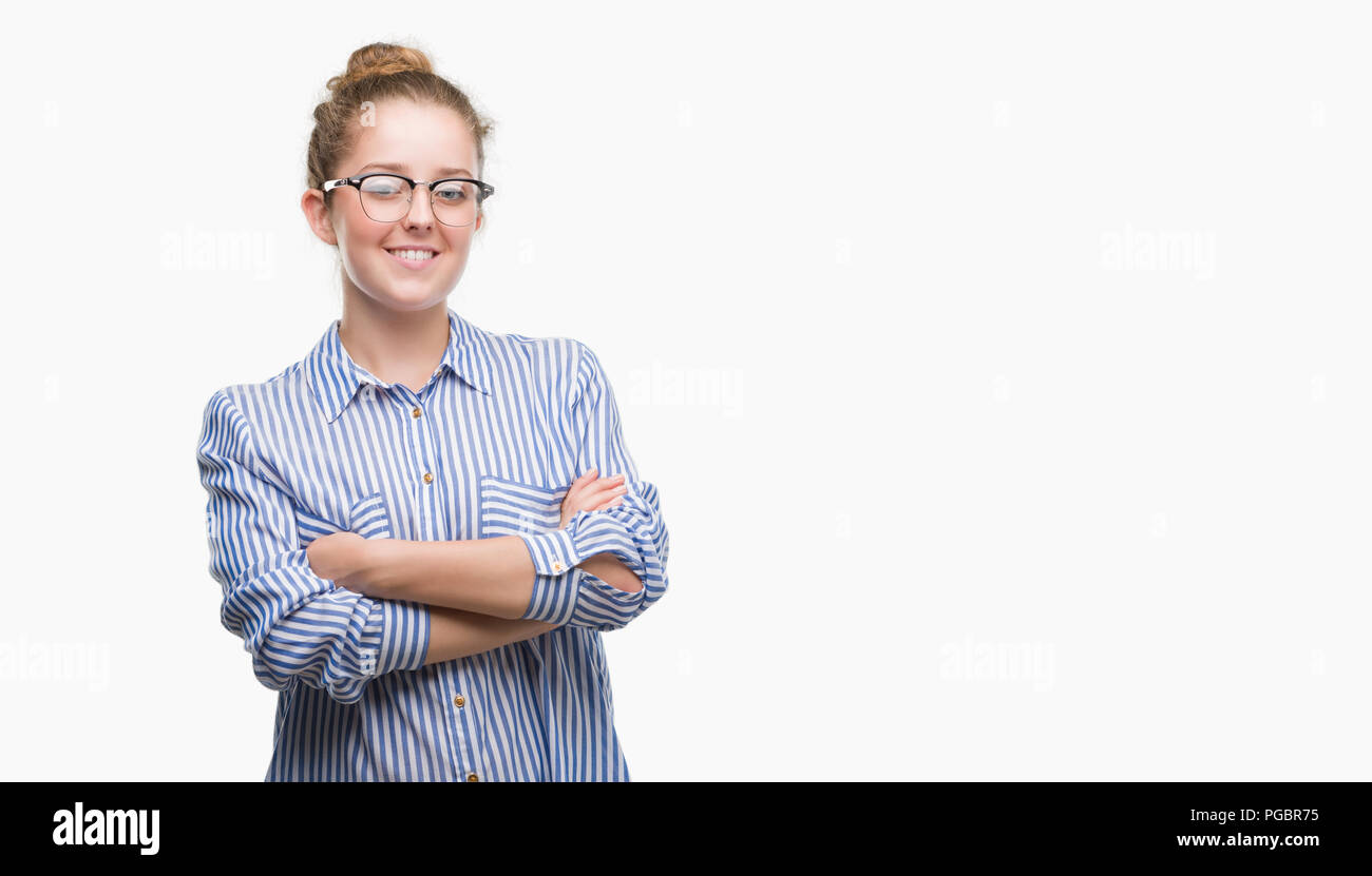 Young blonde business woman happy face smiling with crossed arms looking at the camera. Positive person. Stock Photo