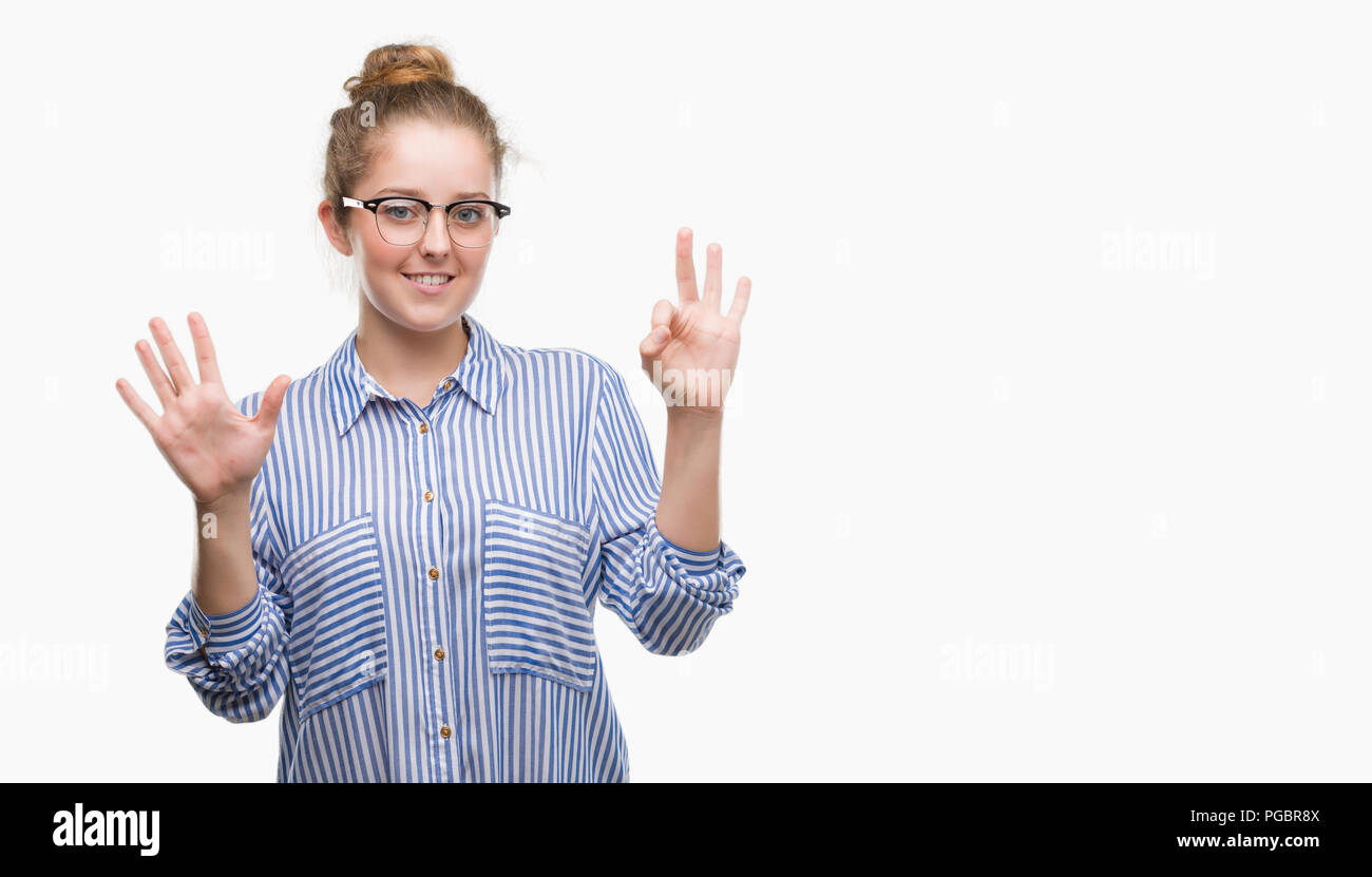 Young blonde business woman showing and pointing up with fingers number eight while smiling confident and happy. Stock Photo