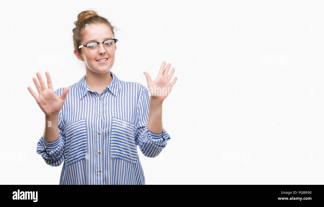 Young blonde business woman showing and pointing up with fingers number ten while smiling confident and happy. Stock Photo