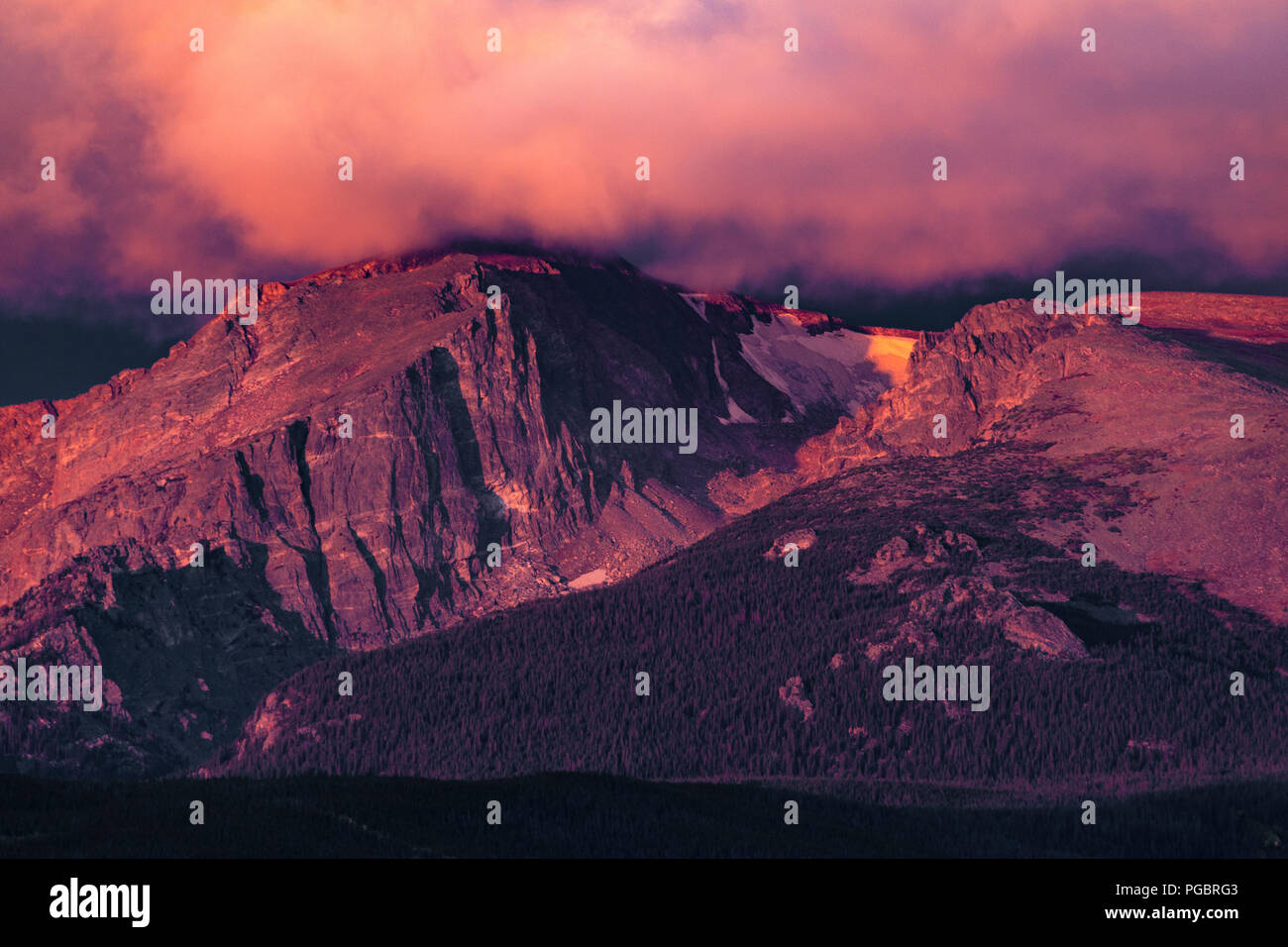 Cloud covered peaks of the Rocky Mountains at sunrise, Colorado, USA Stock Photo