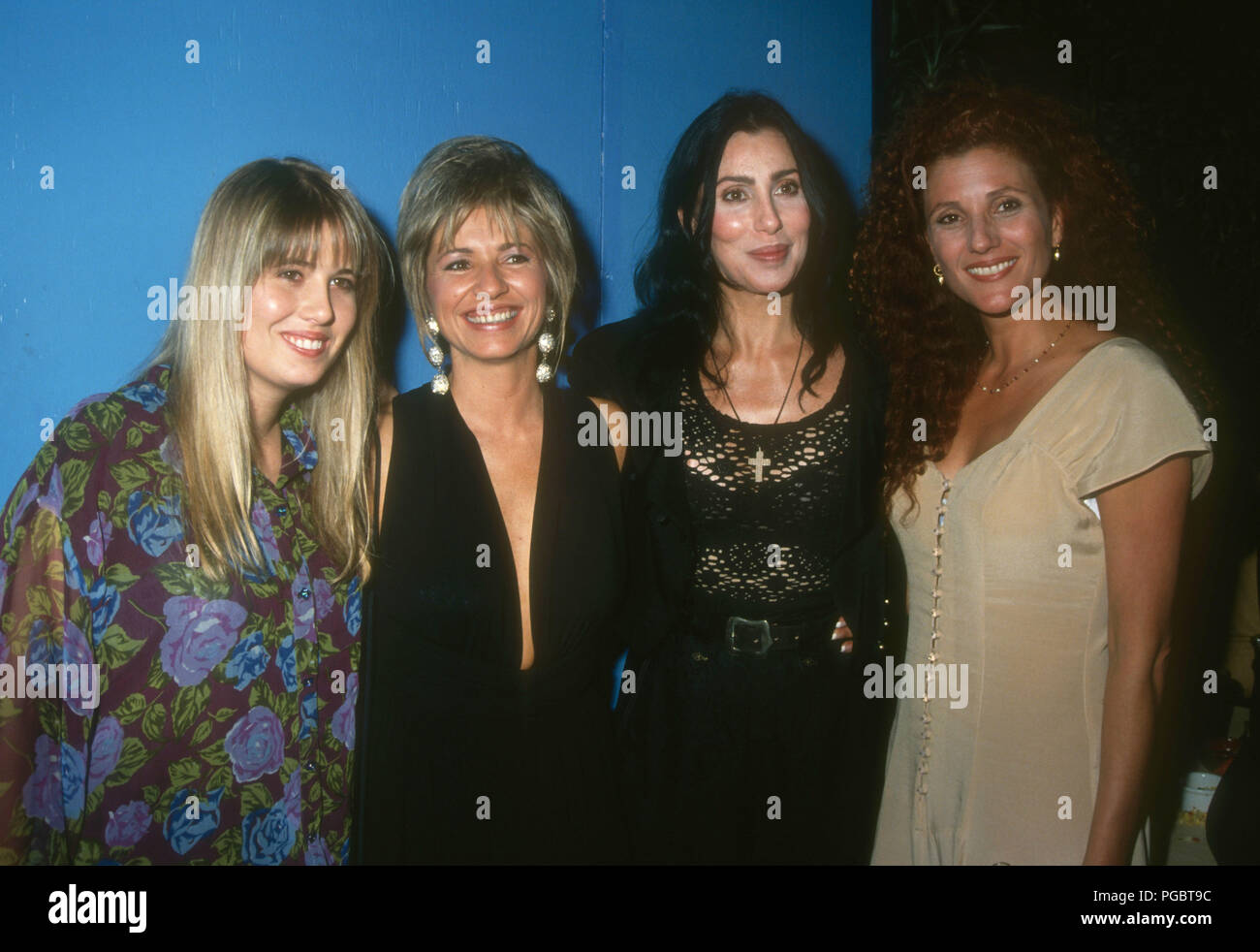 WEST HOLLYWOOD, CA - AUGUST 11: Chastity Bono (Chaz Bono), Christy Bono, singer/actress Cher and Paulette Betts attend Grand Opening of Bono's Restaurant on August 11, 1992 at Bono's Restaurant on Melrose Avenue in West Hollywood, California. Photo by Barry King/Alamy Stock Photo Stock Photo
