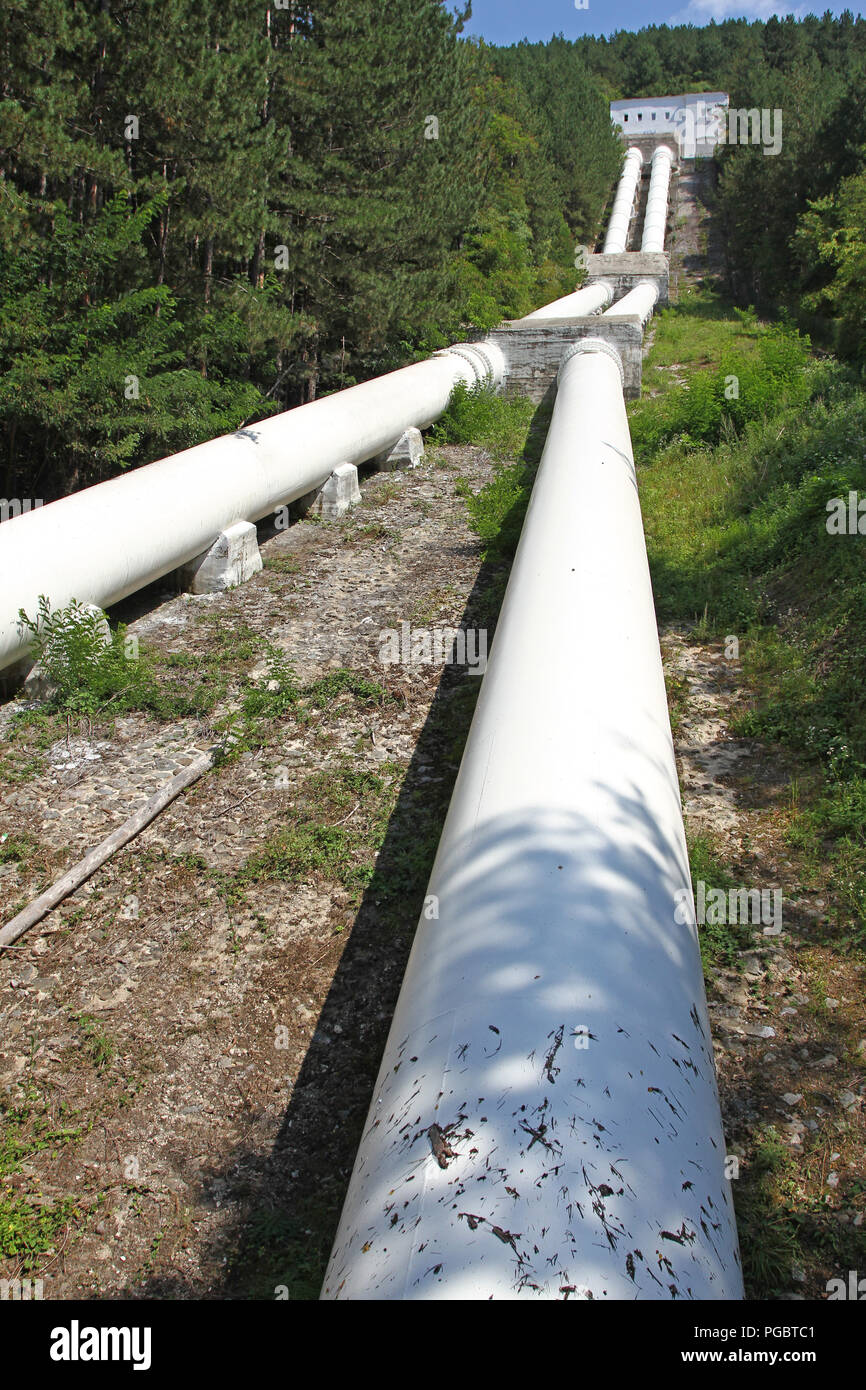 Pipes of a hydroelectric power station in nature. Lake Iskar