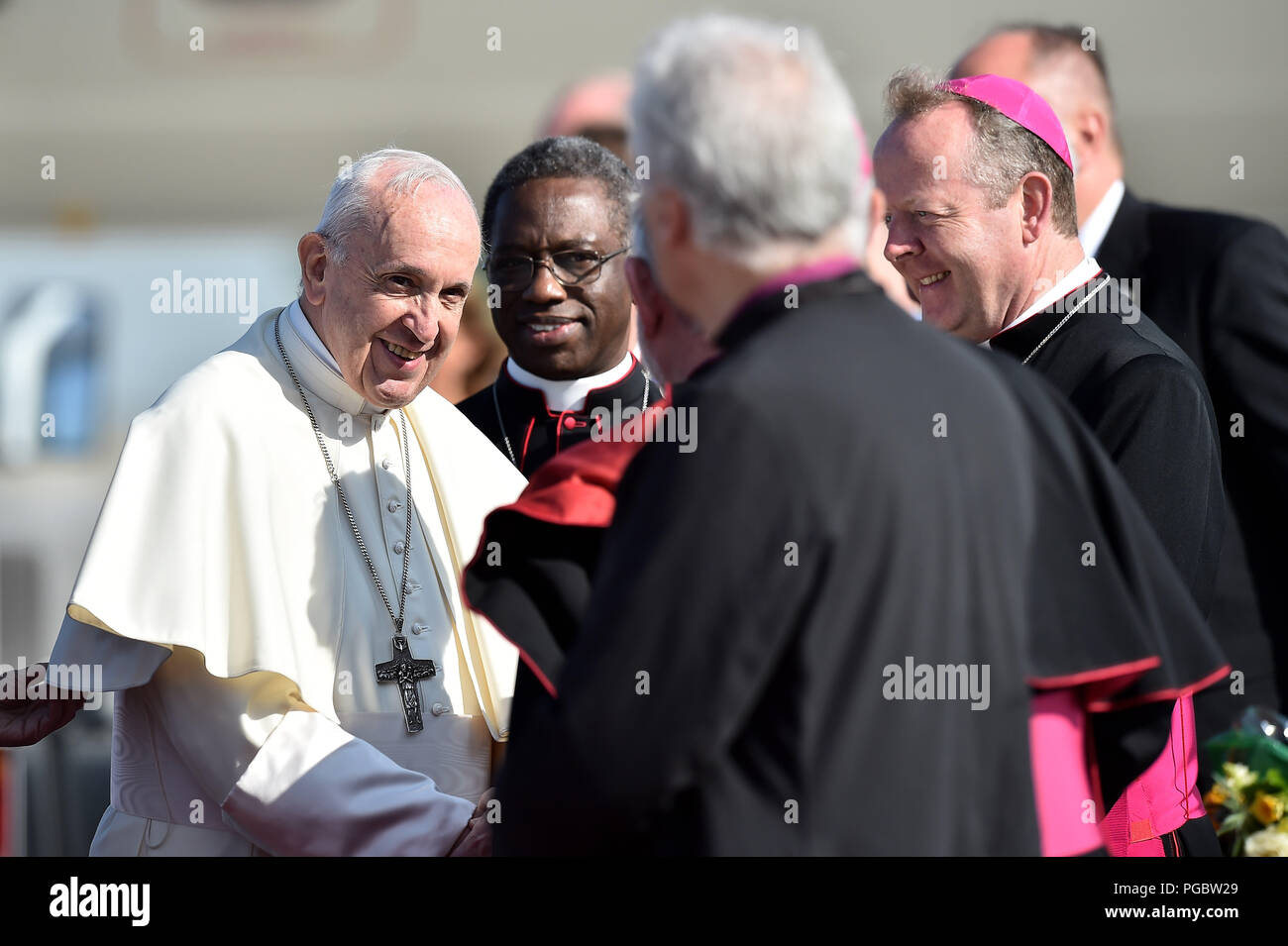Pope Francis greets the clergy upon arrival as he arrives at Dublin Airport as he arrives at Dublin Airport as he arrives at Dublin International Airport, at the start of his visit to Ireland. Stock Photo