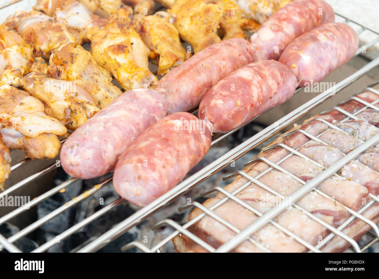 Delicious seasoned barbecue meats on charcoal fire Stock Photo Alamy