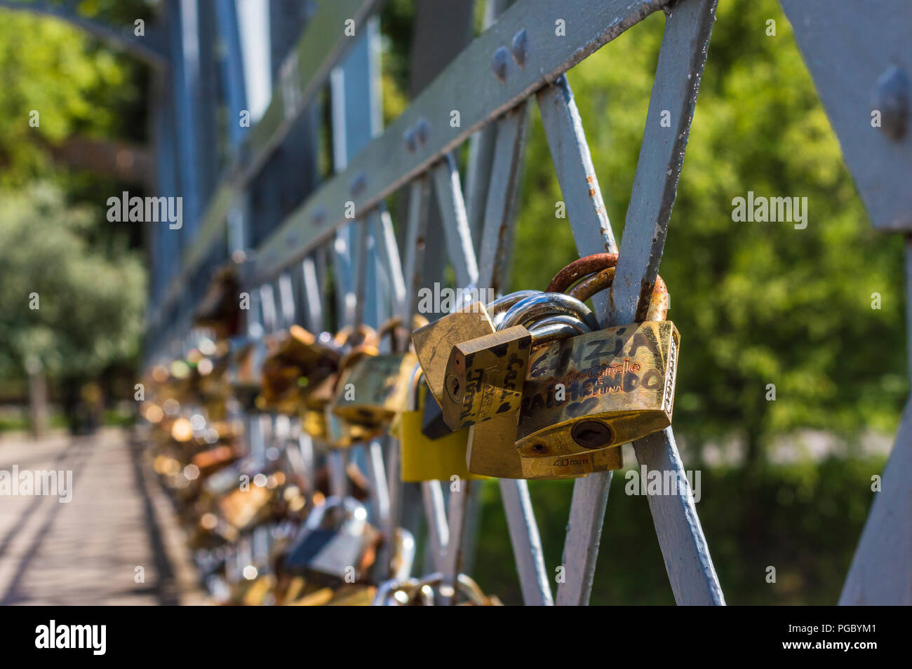 CLUJ-NAPOCA, ROMANIA - JULY 29, 2018: old love padlocks on  Elizabeta Bridge railing  on Somes River in Cluj, Transylvania Stock Photo