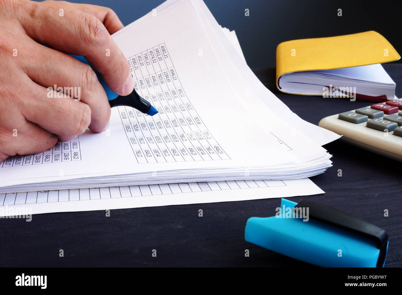 Accountant is checking business report. Accounting concept. Stock Photo