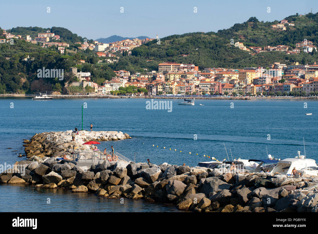 LERICI, LIGURIA, ITALY - AUGUST 18, 2018: View across the bay of popular tourist destination of Lerici to San Terenzo village. Mediterranean coast, Italy. Busy sunny summer day. Stock Photo