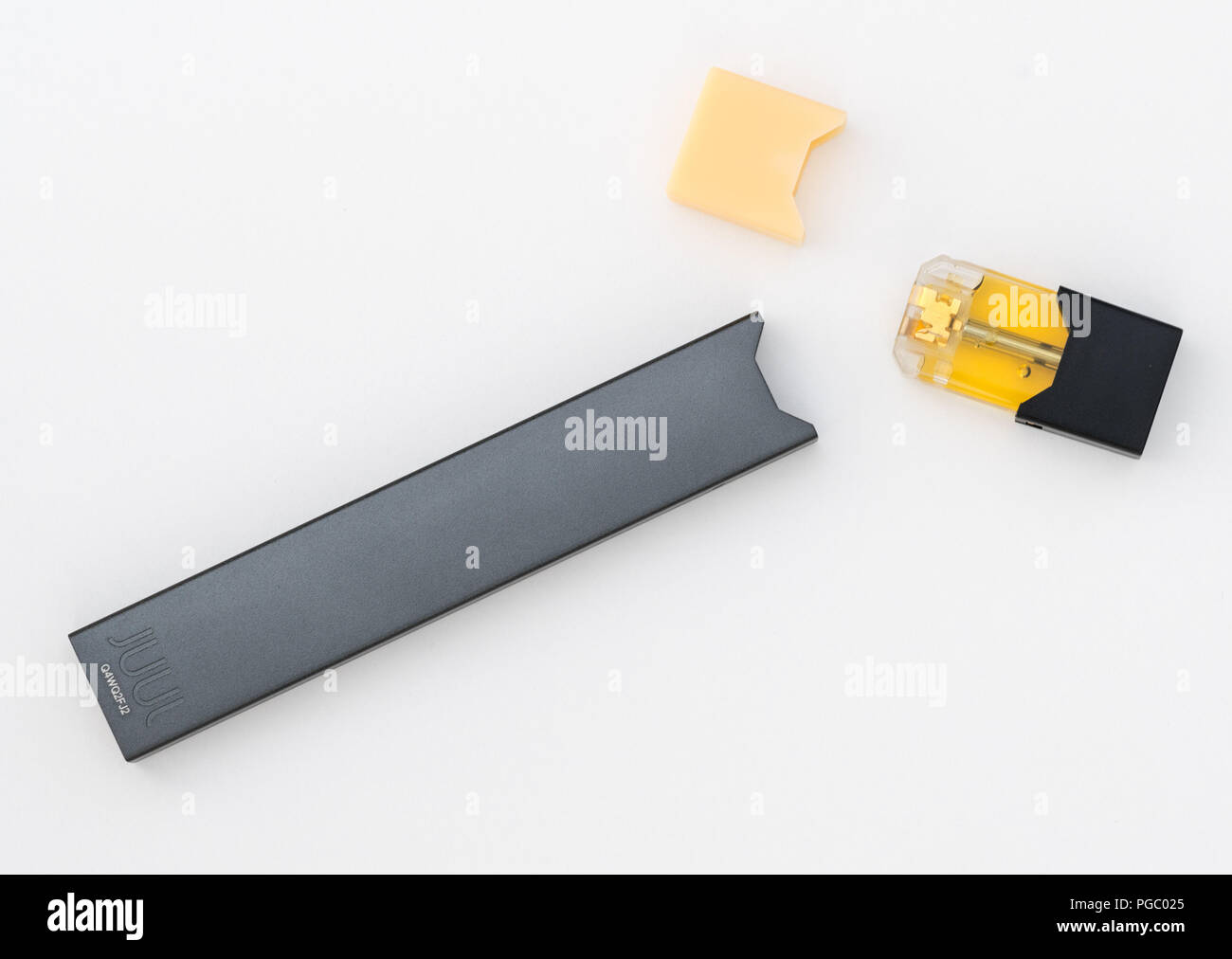 JUULpods and dispenser containing different flavors of nicotine Stock Photo