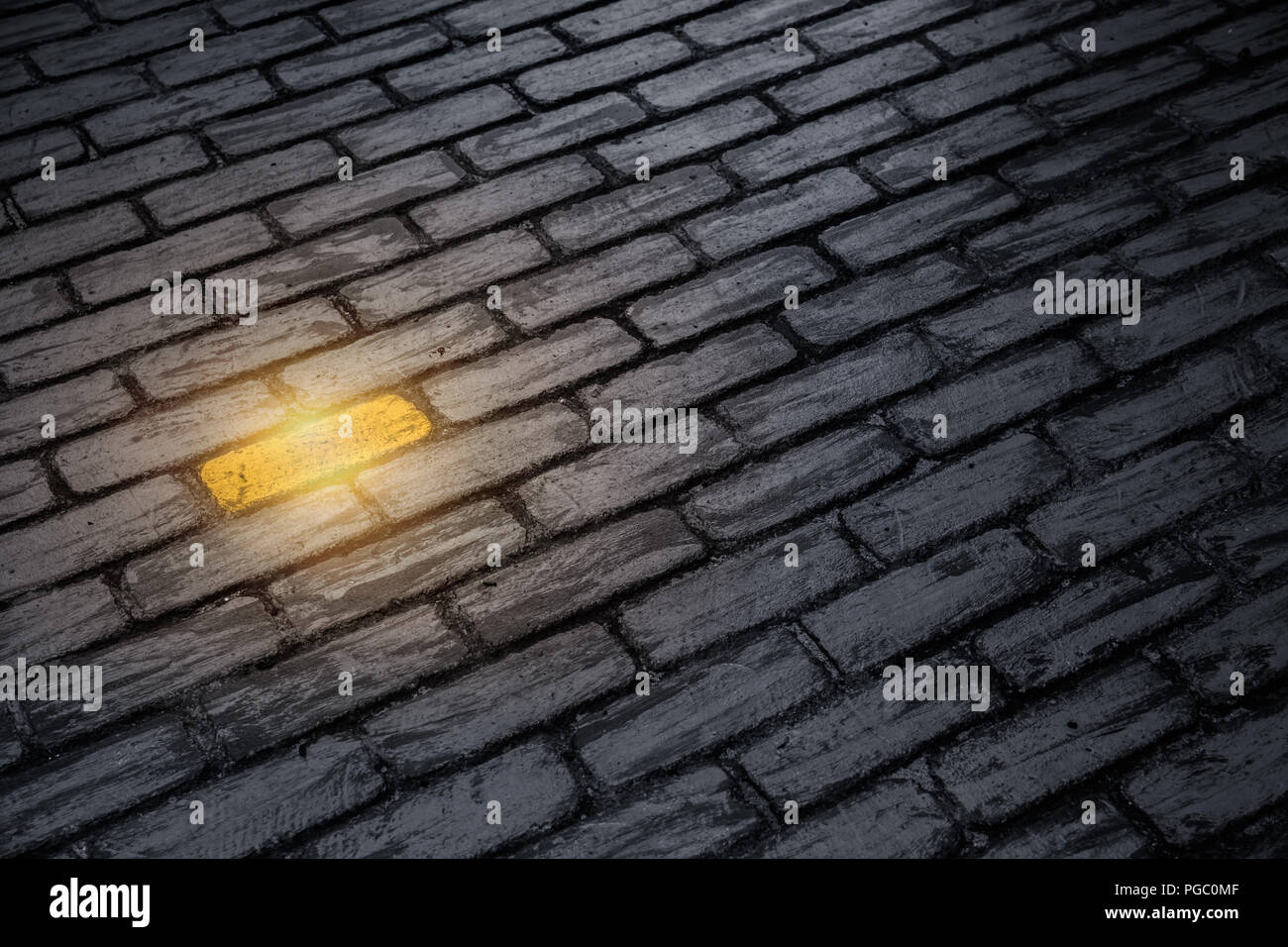 Different business employee performance outstanding concept. unique color golden brick on the wall. Stock Photo