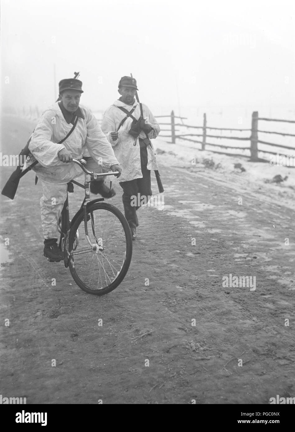 Winter war Finland 1939. A finnish soldier transporting messages on his bicycle close to the front at the Mannerheim line. Photographer Kristoffersson is a war photographer during the first months of the military conflict between the Soviet Union and Finland. Picture taken one month after the outbreak. December 1939 Finland. Photo Kristoffersson 94-3 Stock Photo