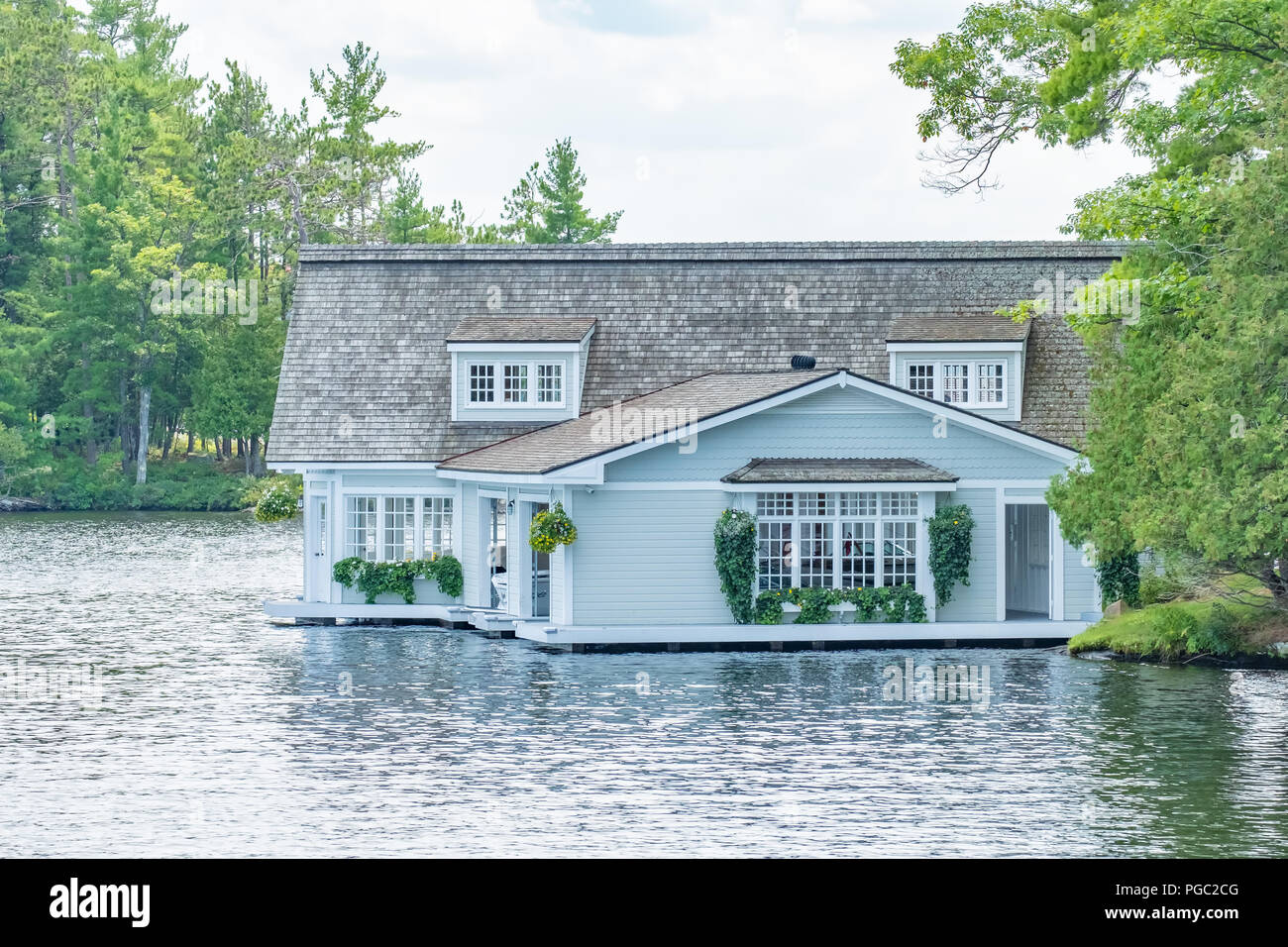 Gorgeous boathouse situated on Lake Muskoka Ontario Canada.  The area is known for itâ€™s highend luxury summer homes. Stock Photo