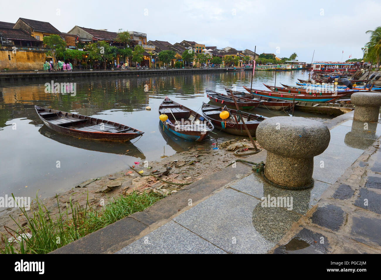 Rowing boats docked in the main canal in the UNESCO World Heritage Site town of Hoi An, in Central Vietnam. Stock Photo