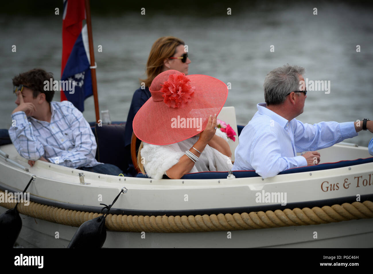 Henley on Thames, ENGLAND, 03/07/2013,  Henley Royal Regatta, Spectators, Holding her Hat against the wind, © Peter SPURRIER Stock Photo