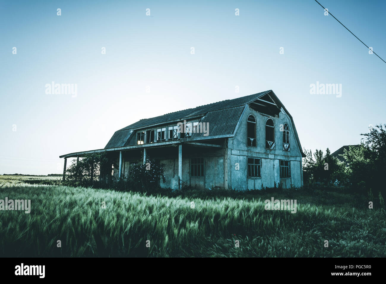 Abandoned building at sunset, mystical effect Stock Photo