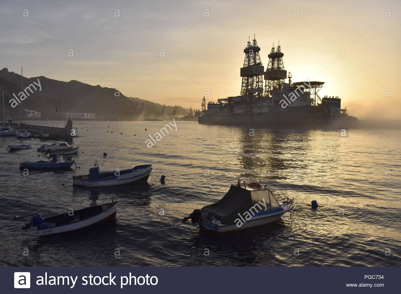 Drillship (oil rig platform) in morning fog. Santa Cruz de Tenerife harbor, Tenerife Canary Islands Spain. Stock Photo