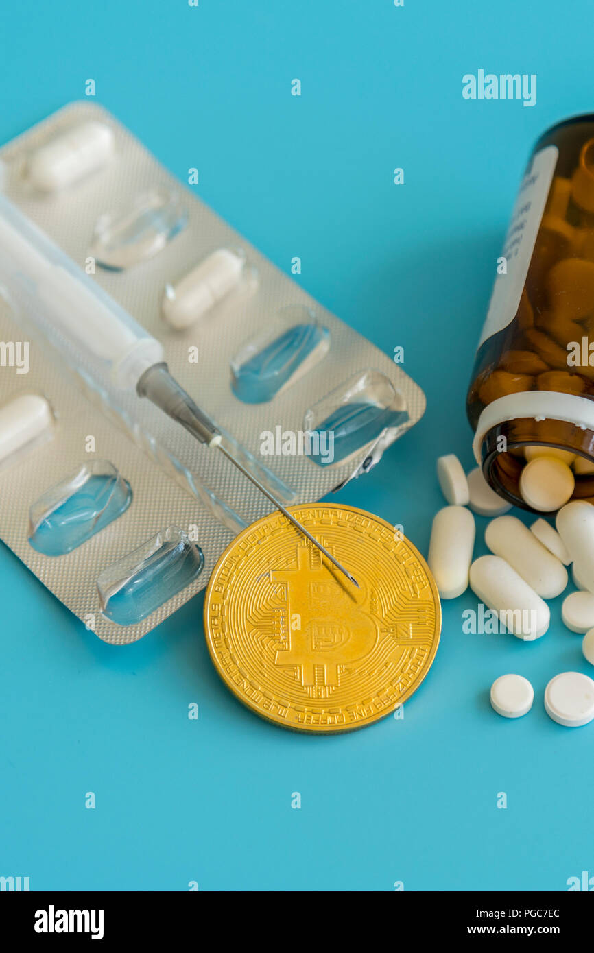 Bitcoin and pills on a blue background. Bitcoin as a medicine for the  economy. Cryptocurrency bitcoin as a payment option for medicines. The  concept o Stock Photo - Alamy
