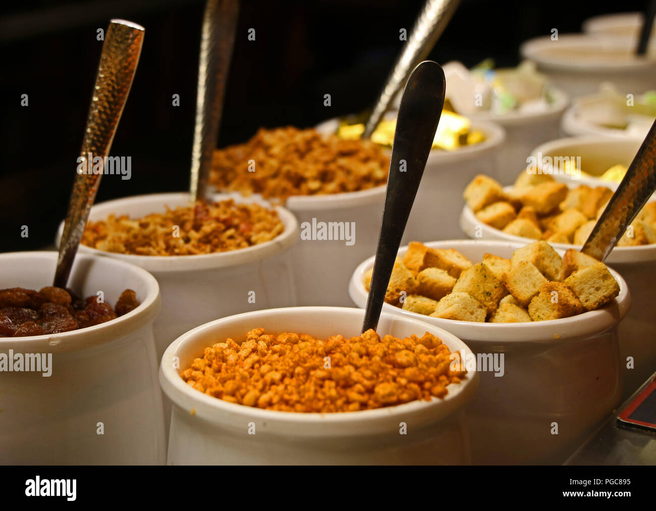 Salad accompaniments and spoons. Stock Photo
