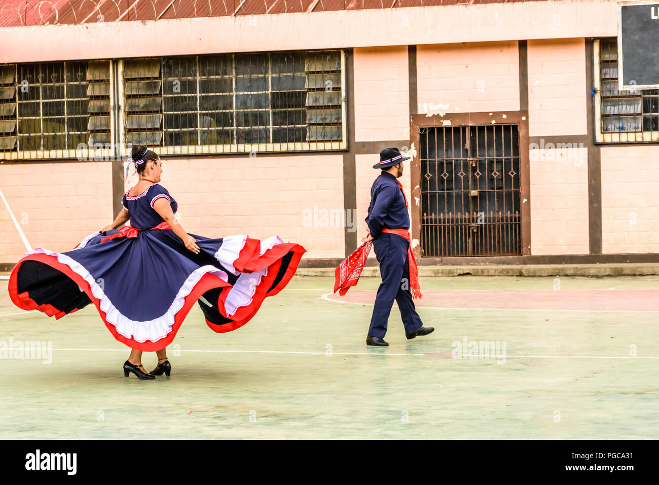 San Juan del Obispo, Guatemala -  August 3, 2018: Costa Rican folk dancers perform near UNESCO World Heritage Site of Antigua. Stock Photo