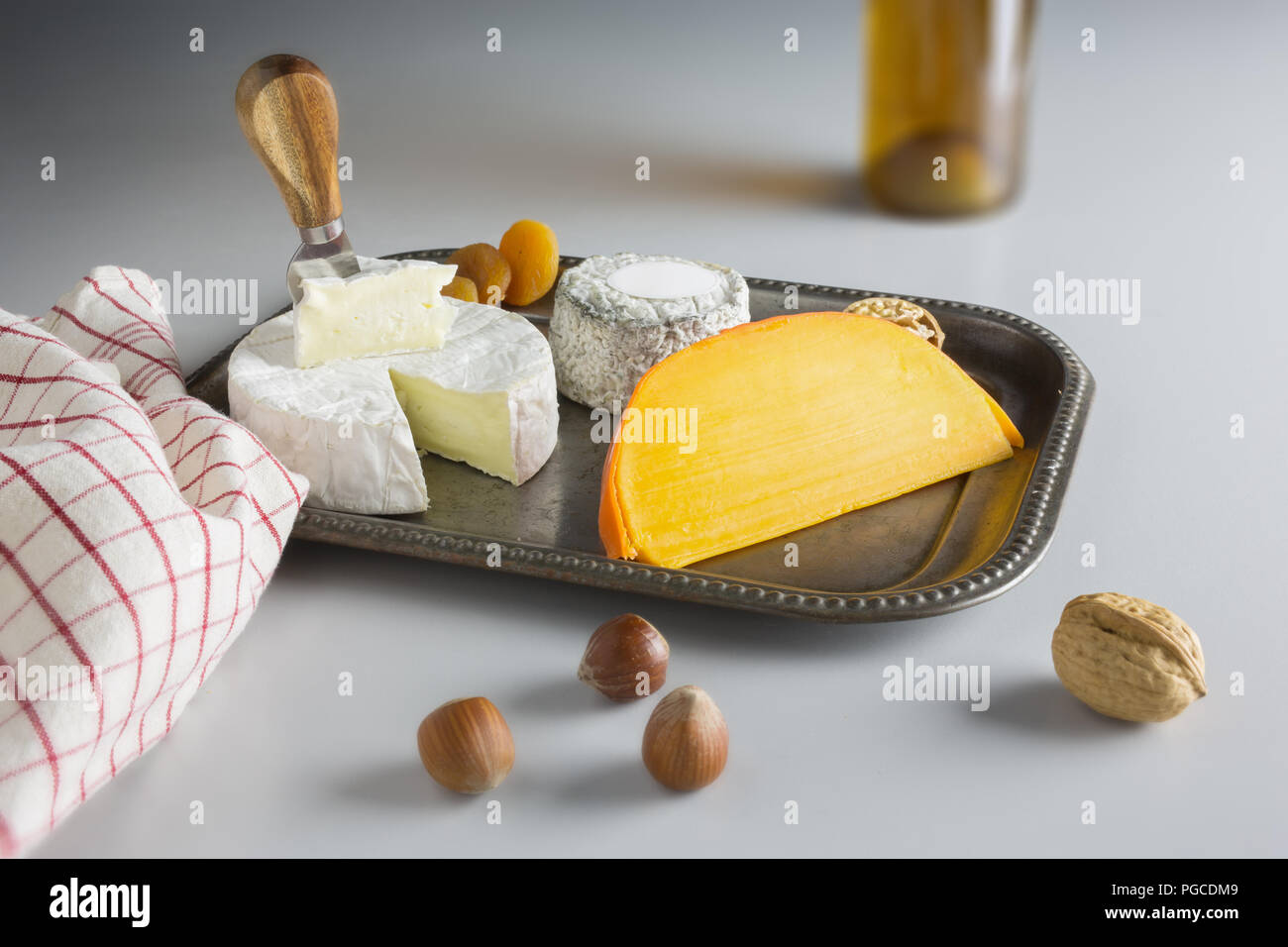 Cheese platter with dried fruit with blur Stock Photo