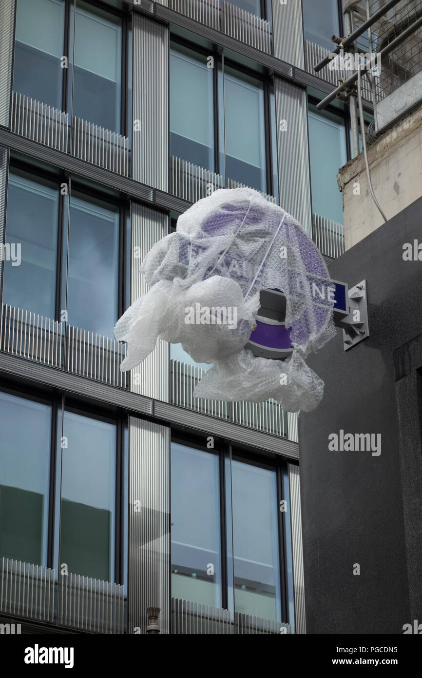 Elizabeth Line signage under wraps on Oxford Street as part of the TFL Tottenham Court Road Crossrail project, London, UK Stock Photo
