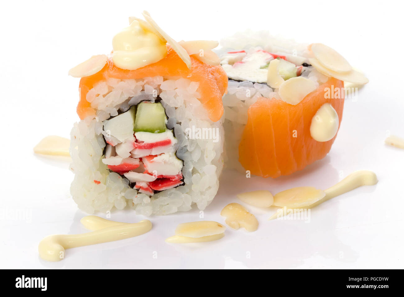Menu of the Japanese restaurant. Two sushi with salmon vegetables with Philadelphia cheese covered with walnut sauce Stock Photo