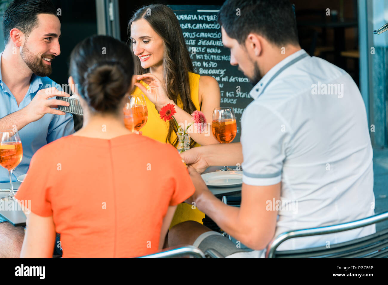 Cheerful friends toasting with a refreshing summer drink Stock Photo