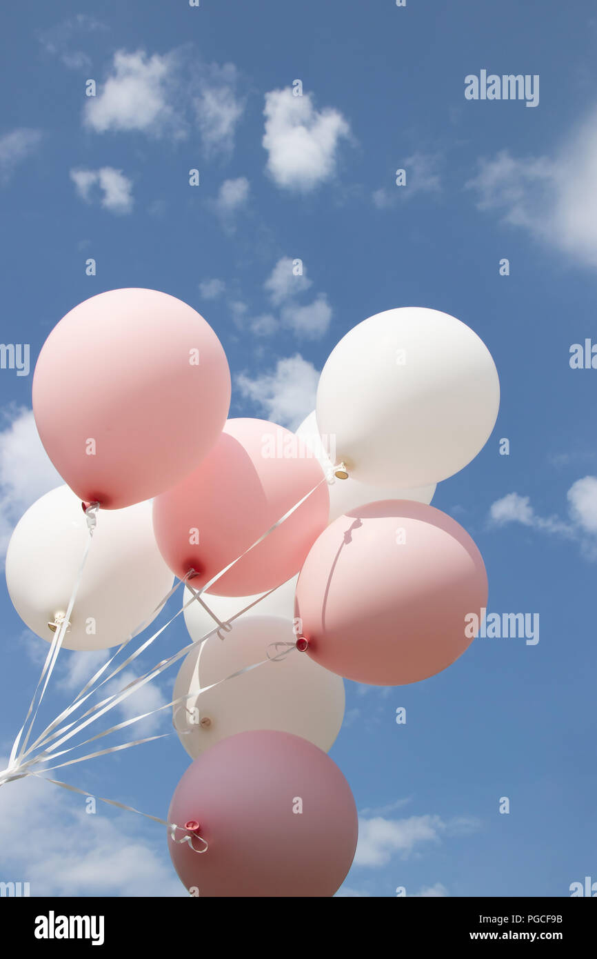 White Pink Balloons Against The Sky Sunny Weather And Sky With Clouds Stock Photo Alamy