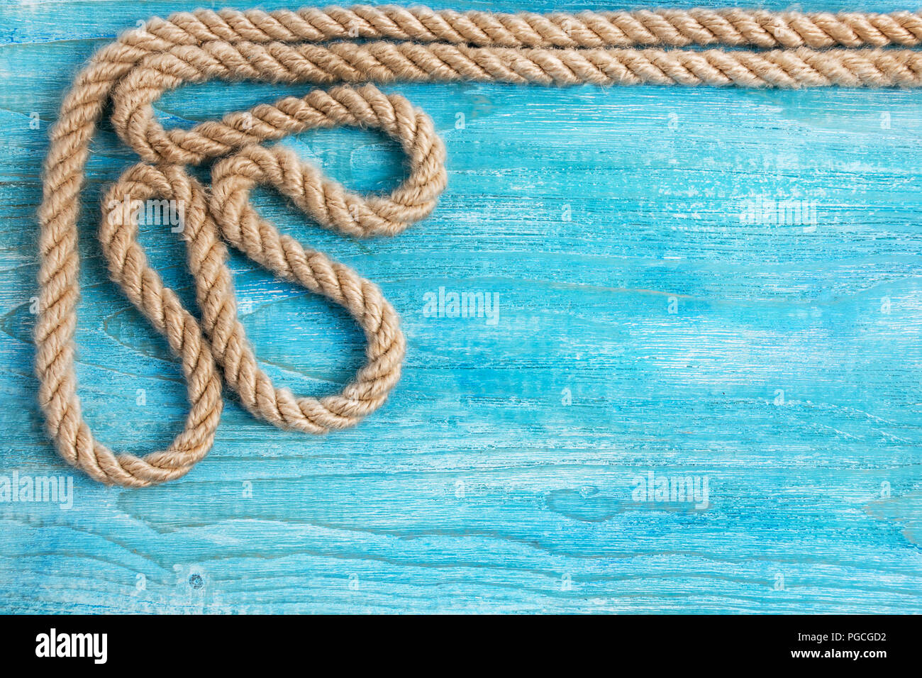 Rope and wooden background Stock Photo