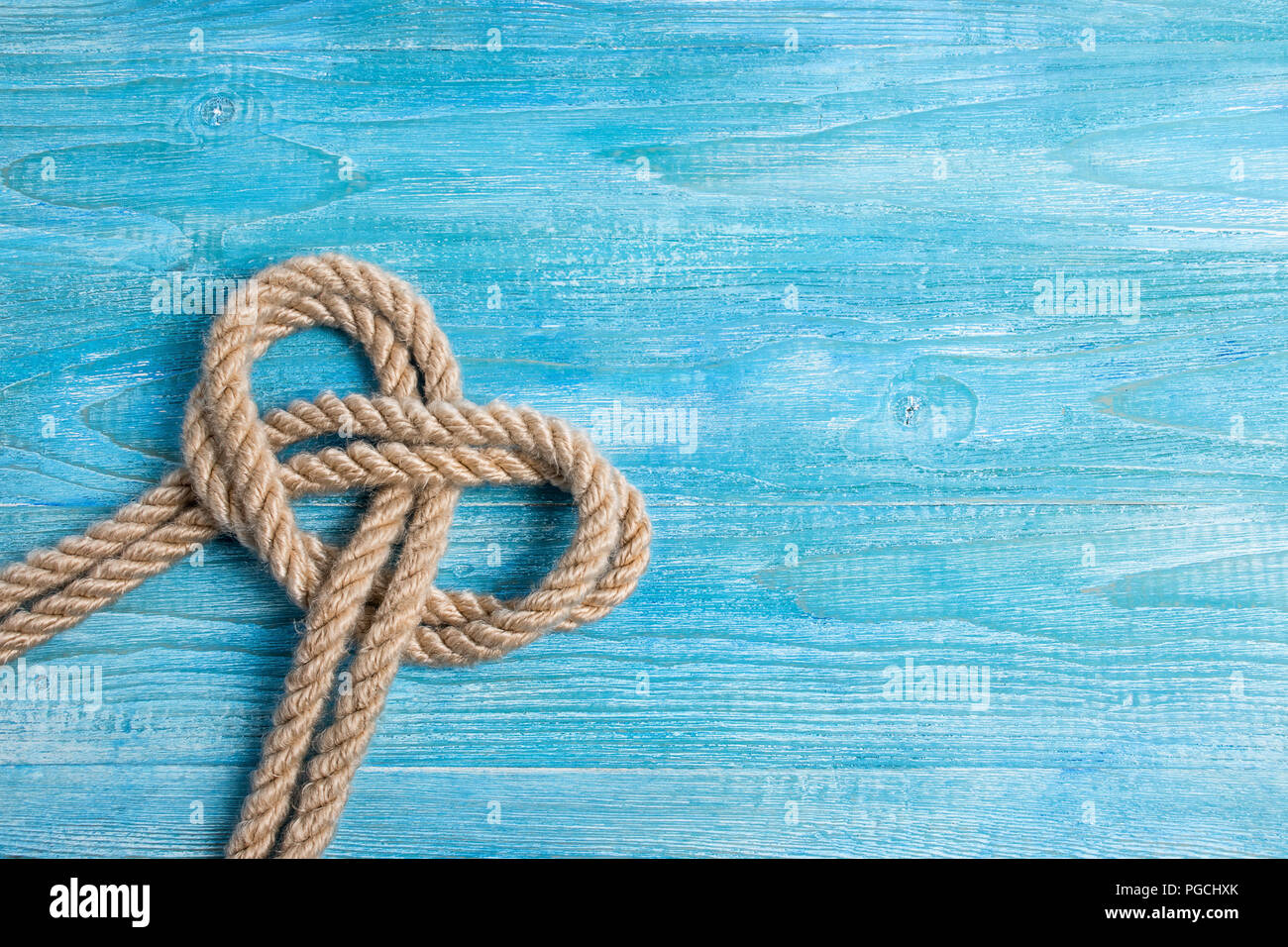 Rope, knot and background wood Stock Photo