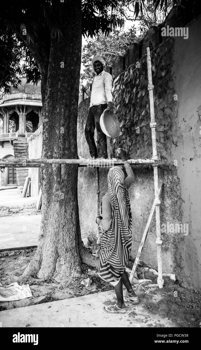 Bricklayers in the courtyard of the mausoleum Itimad-ud-Daulah o little Taj at Agra, India. Stock Photo