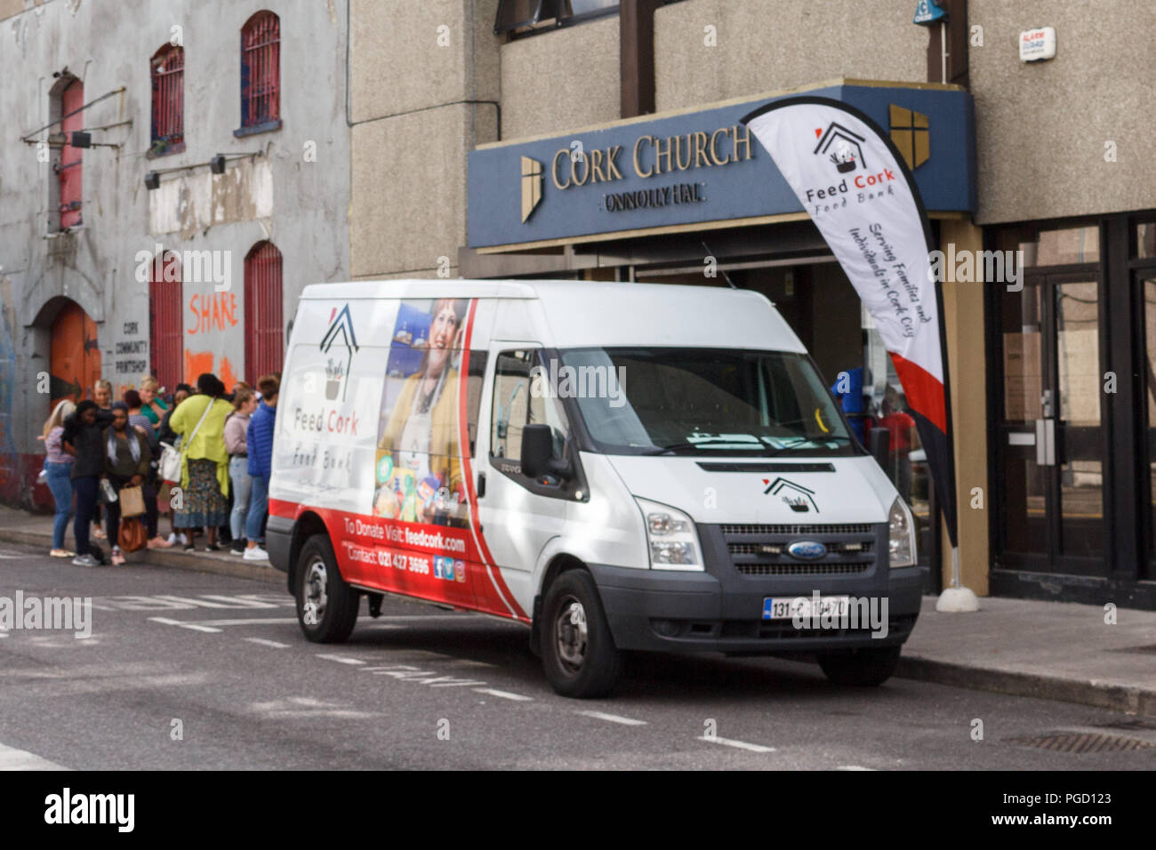 Cork, Ireland. 25th Aug, 2018.   Feed Cork Distributes School Packs. Today at 1pm Cork charity, Feed Cork began distributing back to school packs to parents struggling with the high costs of school supplies in their centre located on Lower Oliver Plunkett Street. Credit: Damian Coleman Credit: Damian Coleman/Alamy Live News Stock Photo