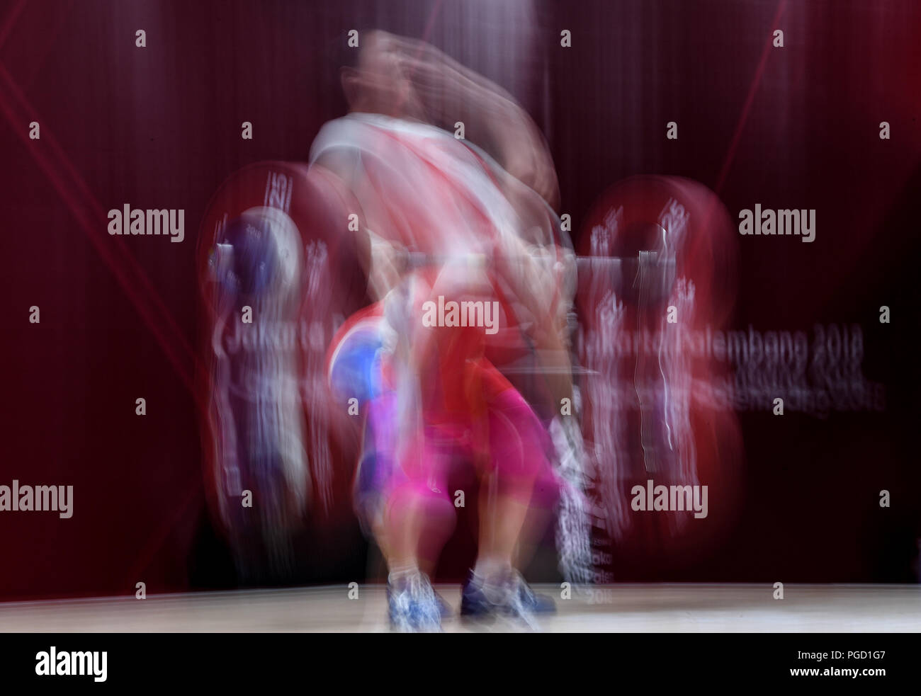 (180825) -- JAKARTA, Aug. 25, 2018 (Xinhua) -- Rim Un Sim of the DPRK competes during the women's weightlifting 69kg event at the 18th Asian Games in Jakarta, Indonesia, Aug. 25, 2018. Rim Un Sim won the gold medal. (Xinhua/Du Yu) Stock Photo