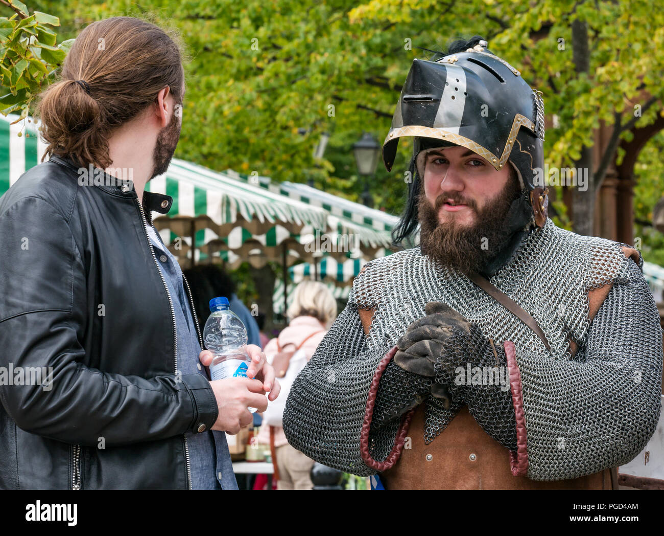 Haddington, Scotland, UK. 25th August 2018. Haddington 700 Celebrations Medieval Big Day, The Medieval Day is the highlight of Haddington 700 events taking place in 2018 to celebrate the granting of a charter by Robert the Bruce to the town in 1318, confirming Haddington's right to hold a market and collect customs. Events across the market town include Medieval children's games and a parade. A man dressed as a Medieval Knight wearing a chainmail top and a pigface bascinet helmet Stock Photo