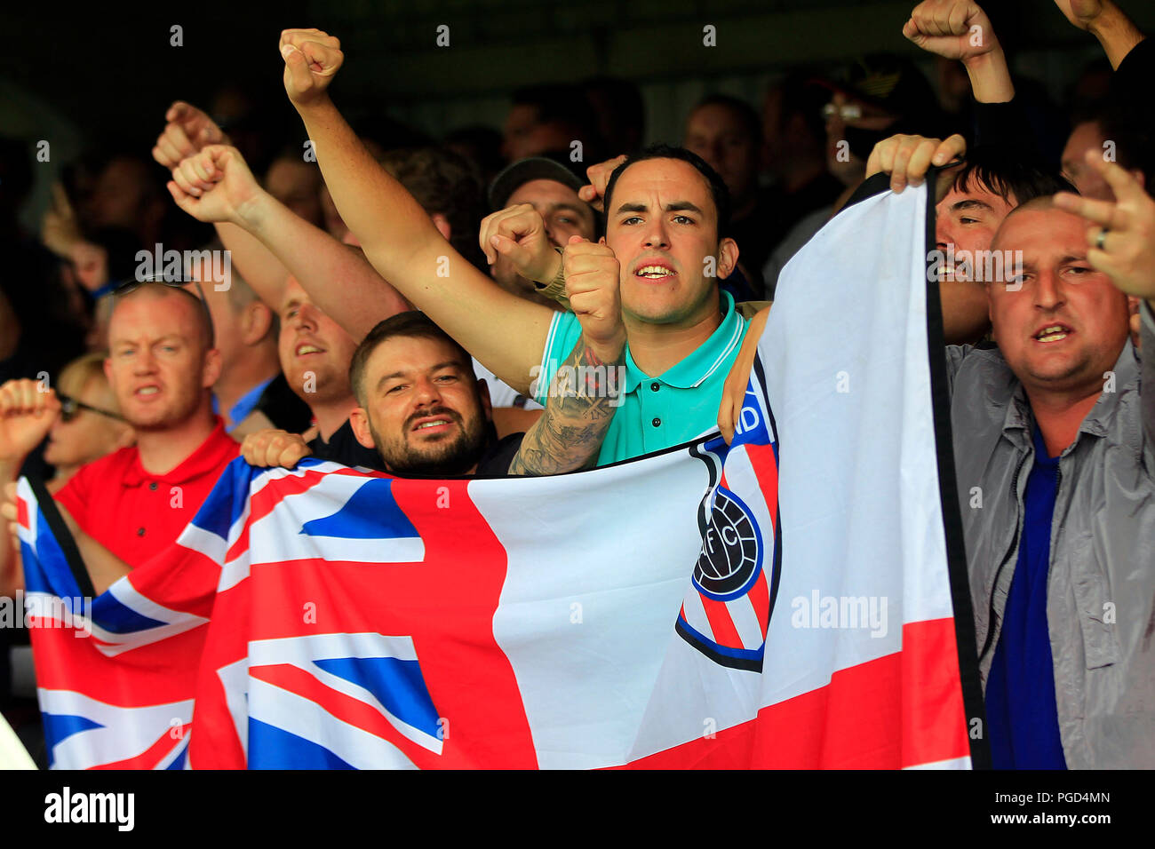 Surrey, UK. 25th Aug 2018. Sunderland supporters cheer their team on. EFL Skybet football league one match, AFC Wimbledon v Sunderland at the Cherry Red Records Stadium in Kingston upon Thames, Surrey on Saturday 25th August 2018. this image may only be used for Editorial purposes. Editorial use only, license required for commercial use. No use in betting, games or a single club/league/player publications. pic by Steffan Bowen/Andrew Orchard sports photography/Alamy Live news Stock Photo