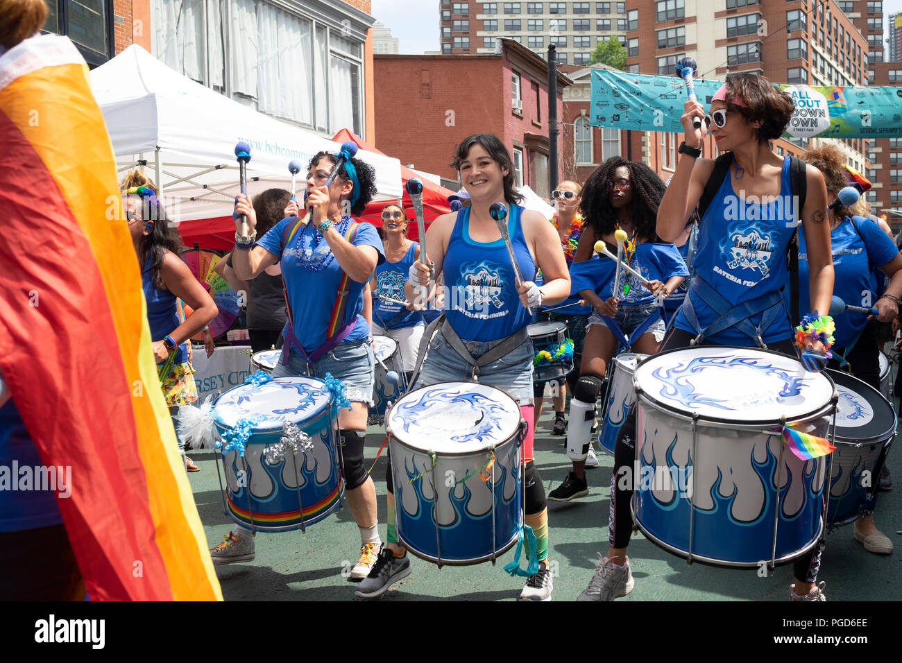 Jersey City, USA.  25th August, 2018:   Front row members of the marching band Fogo Azul lead the band during the 18th Annual Jersey City LGBT Pride Festival in Jersey City, USA. Credit:  Jonathan Carroll/Alamy Live News Stock Photo