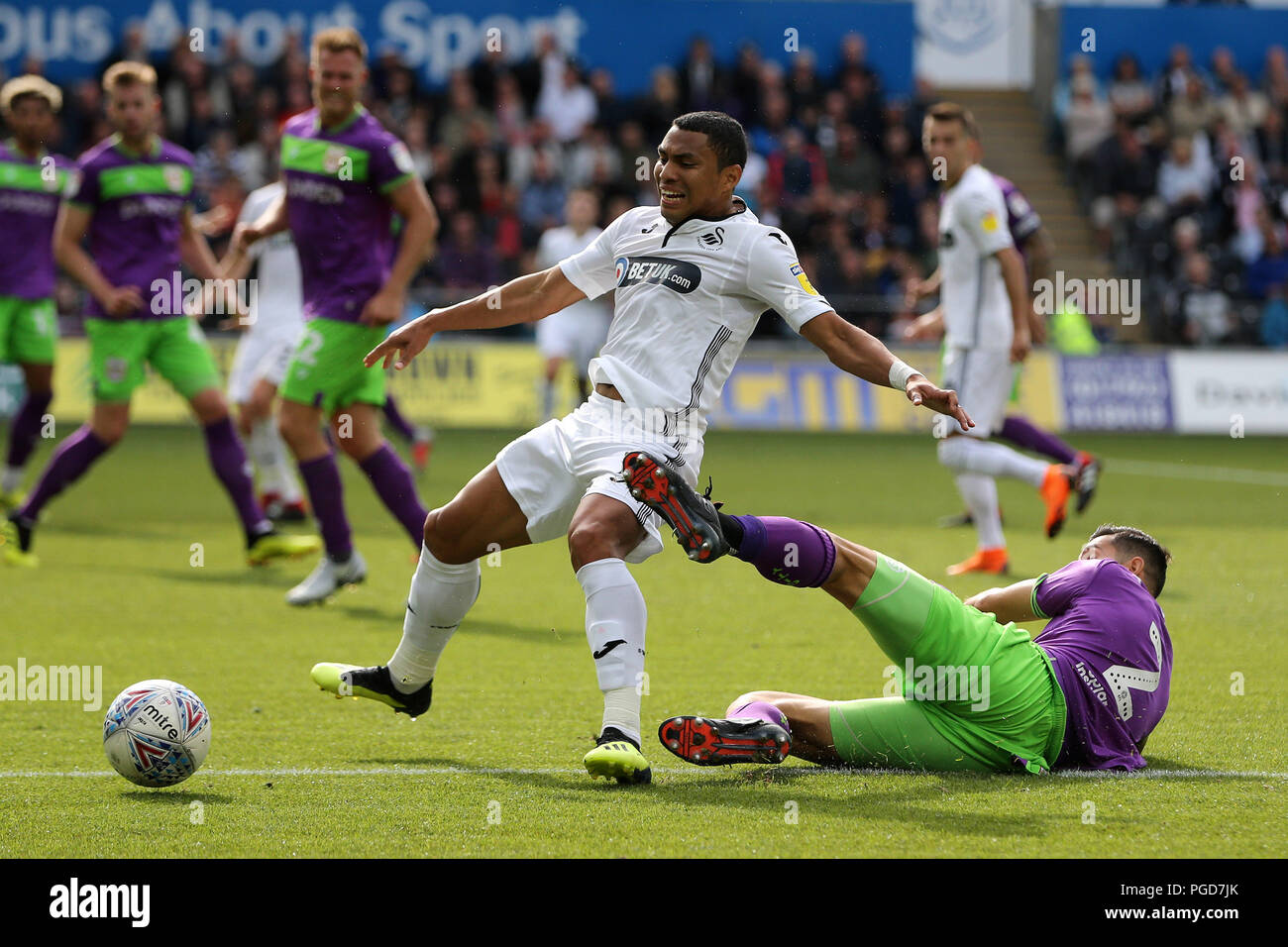 Swansea, UK. 25th Aug, 2018. Editorial use only, license required for commercial use. No use in betting, games or a single club/league/player publications.  Jefferson Montero of Swansea city is tackled by Eros Pisano of Bristol city. EFL Skybet championship match, Swansea city v Bristol city at the Liberty Stadium in Swansea, South Wales on Saturday 25th August 2018.  this image may only be used for Editorial purposes. Editorial use only, license required for commercial use. No use in betting, games or a single club/league/player publications. pic by Andrew Orchard/Andrew Orchard sports photog Stock Photo