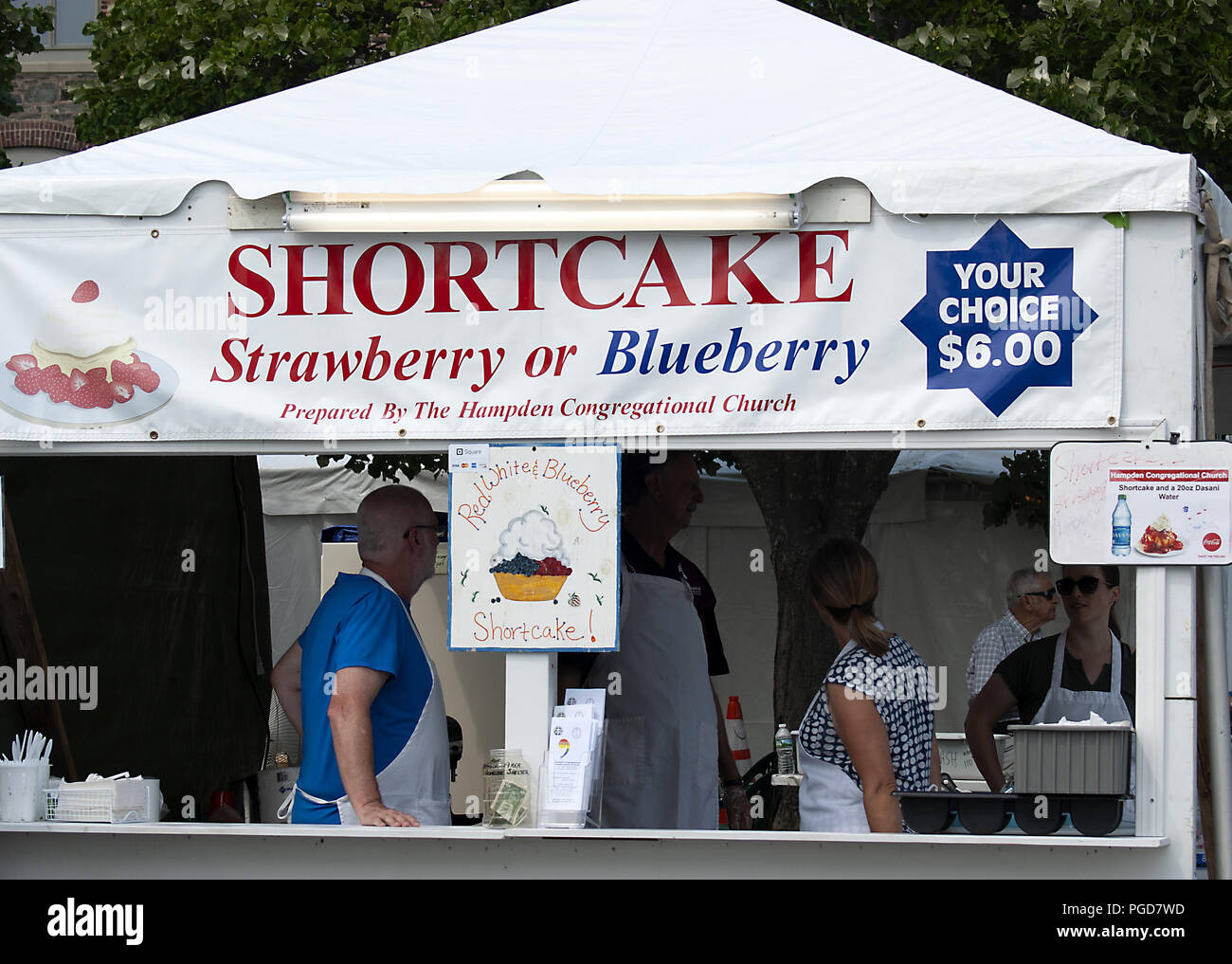 Bangor, Maine, USA.25th August, 2018. Food vendors at the American Folk Festival. This festival was named one of the world's best music festivals by Conde Nast Traveller. Located on the banks of the Penobscot River, the weather is almost always perfect, with a cool breeze and sunny skies. Tourists come from all over the world to listen to a variety of folk music and sample great food. Credit: Janet S. Robbins/Alamy Live News Stock Photo